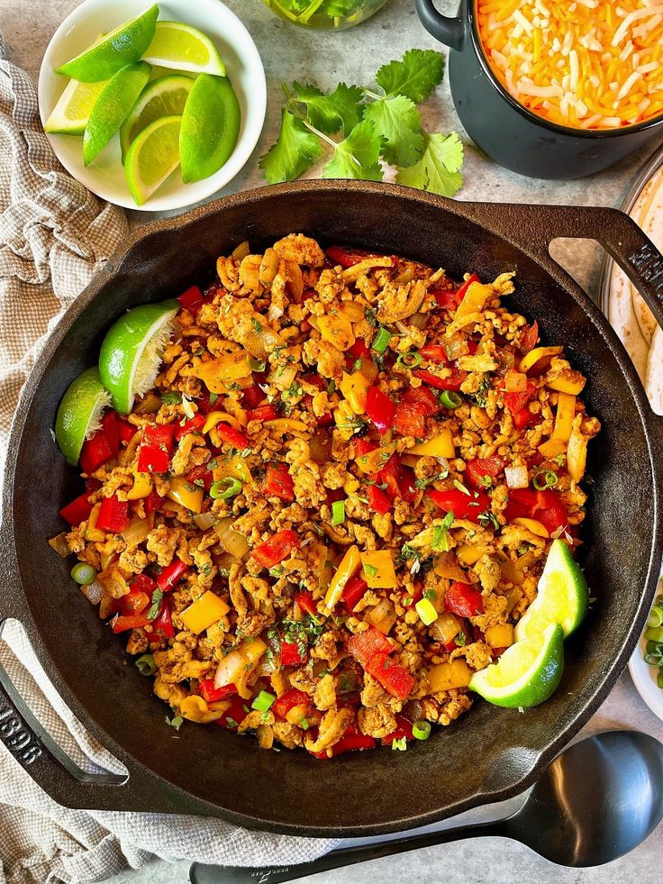 a skillet filled with mexican rice and vegetables