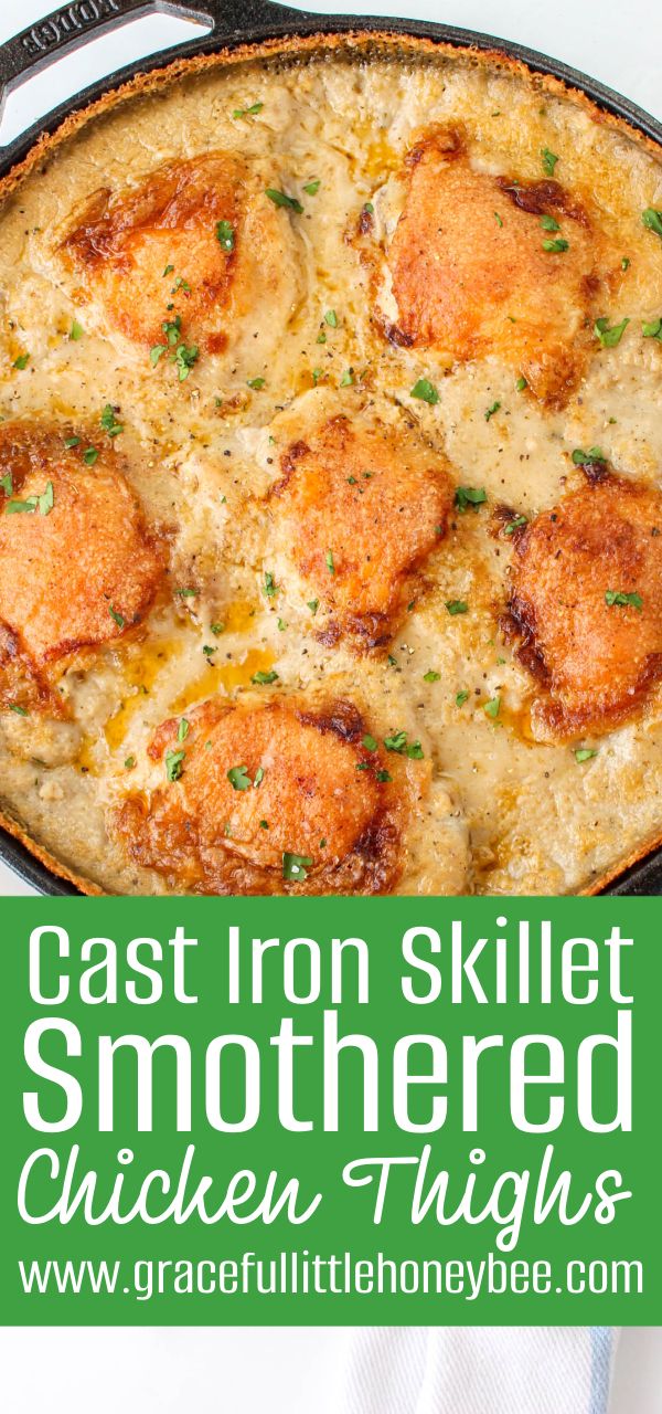 cast iron skillet smothered chicken thighs in a creamy, cheesy sauce