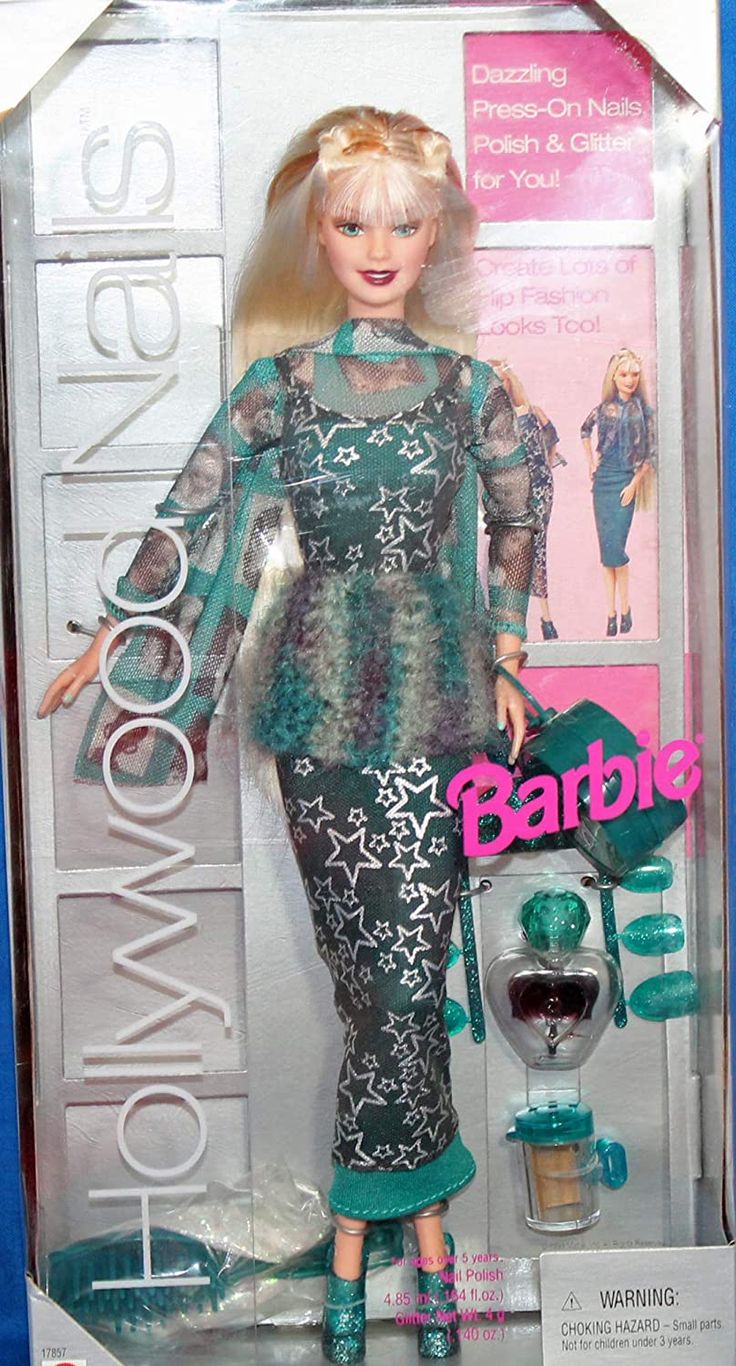 the barbie doll is wearing a green dress and matching shoes with her hair in a bun