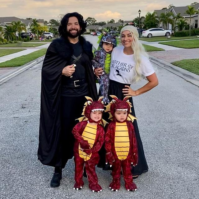 a family dressed up in costumes for halloween