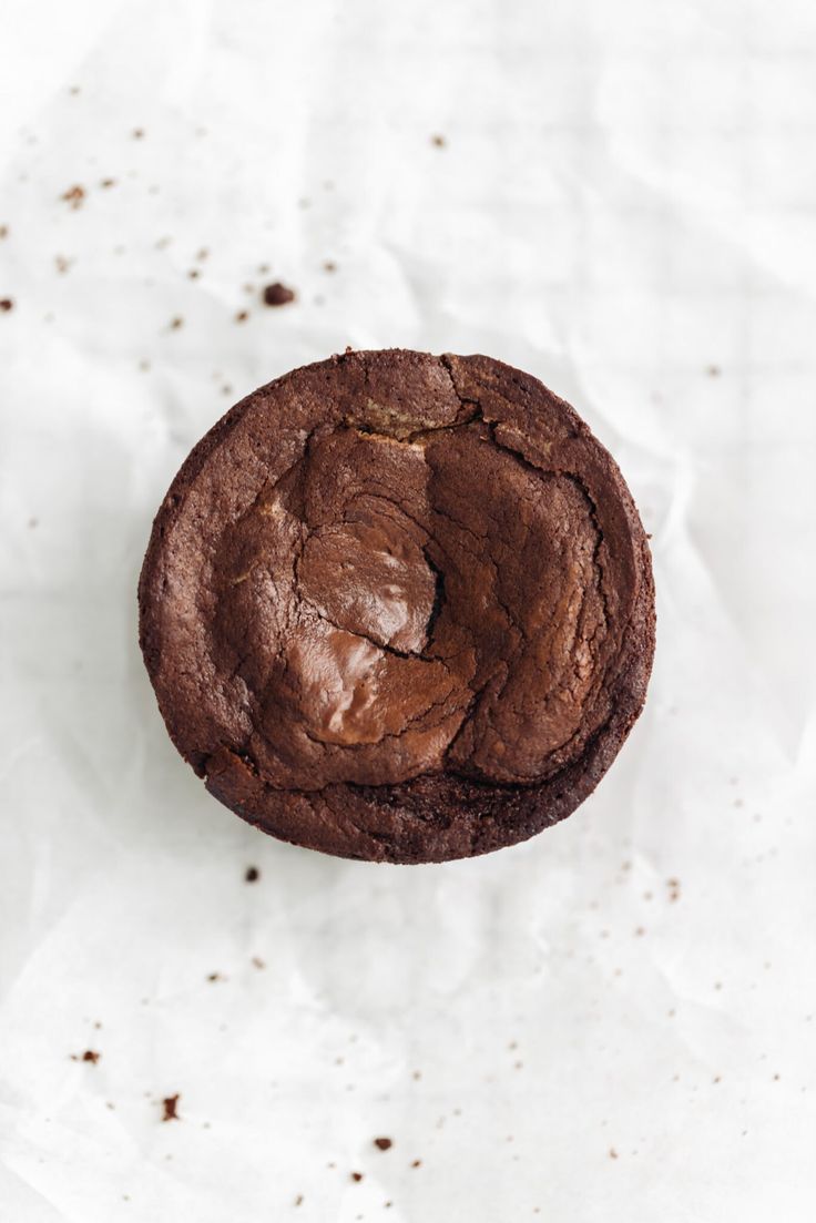 a chocolate cookie on top of white paper