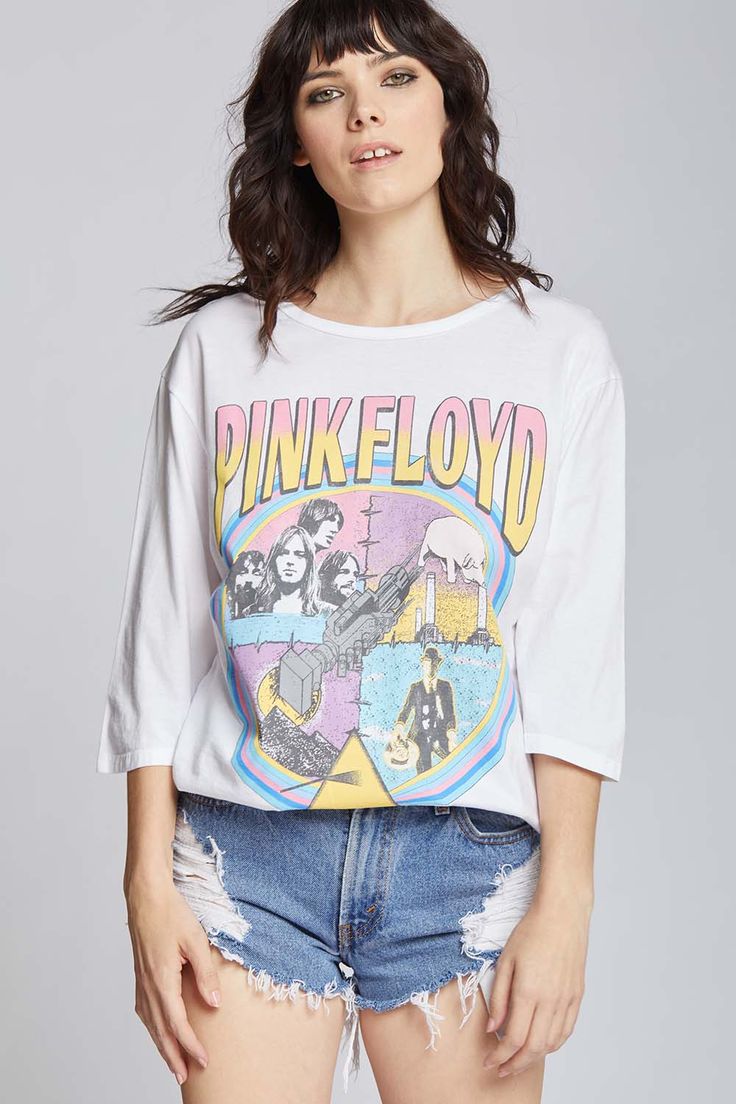 For our Pink Floyd lovers, here is your new favorite band tee! This unique t-shirt features a compilation of artwork from some of their most famous albums including, "Wish You Were Here" and "Animals". Made with soft cotton fabric, 3/4 sleeves, a crewneck collar, and loose comfortable fit. Details Style #301982 Color: White Pink Floyd Vintage Style 3/4 Sleeve Oversized T-Shirt 100% Cotton Care/Import Machine Wash Cold, Tumble Dry Low Designed and Finished in Los Angeles Measurements Model is wea Band Merch Tops With Screen Print For Fans, Alternative Style Graphic Print Tops For Fans, Pop Culture Screen Print Tops For Concerts, Pop Culture Band Logo Crew Neck Top, Pop Culture Cotton Top With Band Logo, Alternative Graphic Print Tops For Music Festivals, Relaxed Fit Top With Graphic Print And 3/4 Sleeve, Relaxed Fit Top With 3/4 Sleeves And Graphic Print, White Grunge Tops For Music Festivals