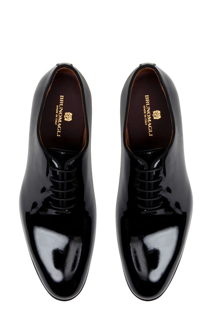 Wholecut construction emphasizes the minimalist profile of a tuxedo shoe crafted from Italian patent leather and styled to complement any formal look. Lace-up style Leather upper, lining and sole Made in Italy Fitted Oxfords With Rubber Heel Cap For Business, Business Oxfords With Rubber Heel Cap, Evening Plain Toe Oxfords, Formal Oxford Shoes With Rubber Sole, Evening Oxfords With Leather Sole And Plain Toe, Luxury Patent Leather Oxfords For Formal Occasions, Formal Patent Leather Shoes With Branded Insole, Luxury Patent Leather Evening Oxfords, Evening Oxfords With Leather Sole