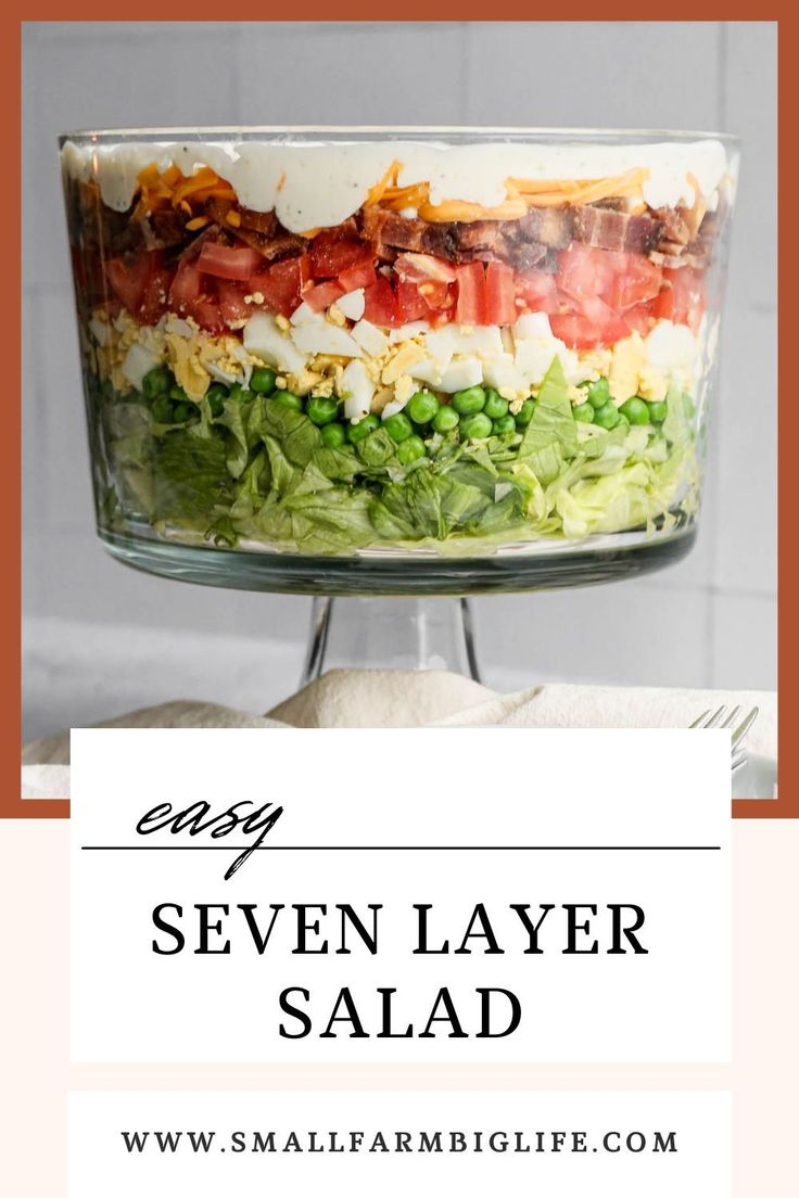 a layered salad in a glass dish with the title saying easy seven layer salad