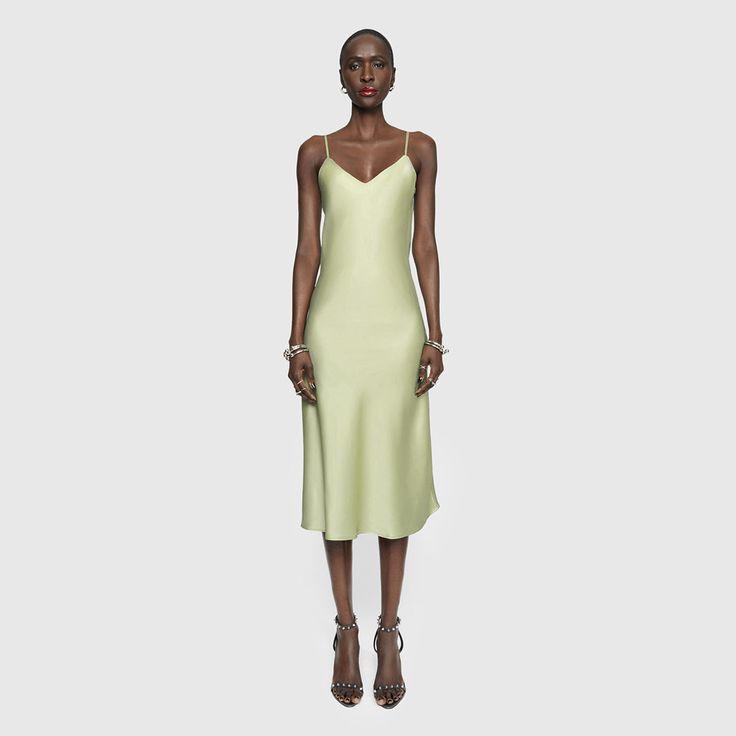 This product is made to order and ships within 15-25 days. Our Verona Slip Dress is the secret ingredient to looking unbelievably chic with minimal effort. The midi-length, satiny number ends in an undulating hemline. It's just the kind of thing you can wear to a gala or a garage show. In partnership with Resonance, this item is sustainably made to order and environmentally friendly. We don't make it, until you order it. | Rebecca Minkoff Verona Slip Dress In Mint - Size 16 Sleek Solid Color Formal Slip Dress, Sleek Solid Color Slip Dress For Formal Occasions, Sleek Formal Midi Length Slip Dress, Chic Solid Color Silk Midi Dress, Sleek Solid Color Bias Cut Dress, Sleek Solid Color Bias-cut Dress, Sleek Silk Midi Dress For Summer, Formal Summer Midi Dress With Satin Finish, Chic Midi-length Satin Slip Dress