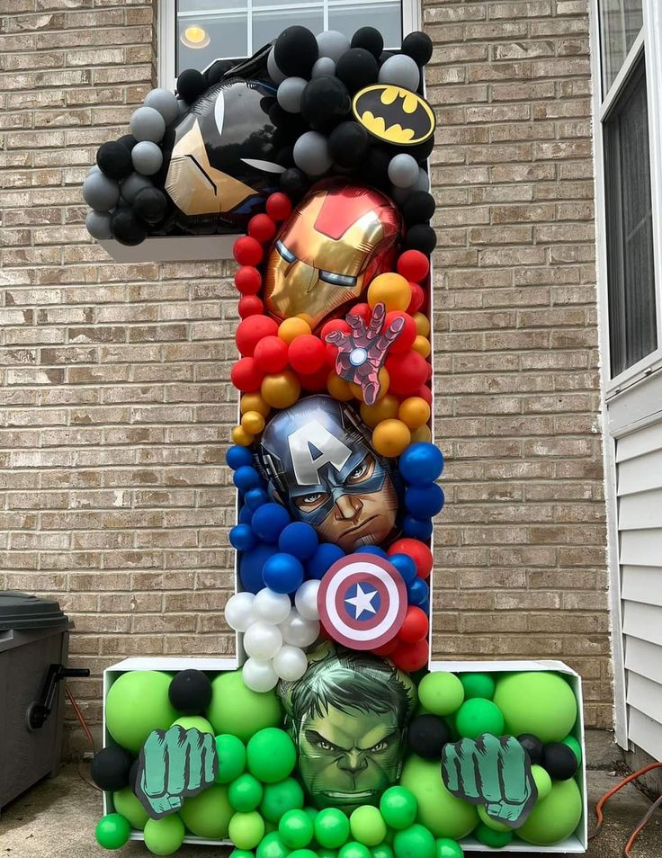 an inflatable number one made out of balloons and other items is displayed outside