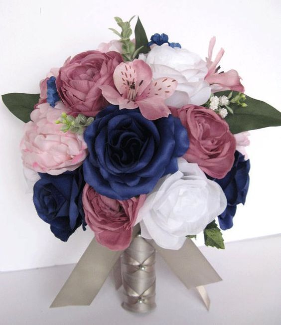 a bridal bouquet with blue, pink and white flowers