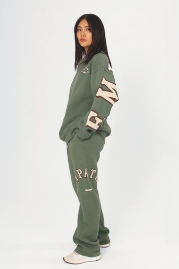 Empathy Always Olive Sweatpants – The Mayfair Group LLC Oversized Fleece Sweatpants In Athleisure Style, Oversized Fleece Sweatpants Athleisure, Oversized Fleece Sweatpants For Athleisure, Relaxed Fit Sweatpants For Fall Sportswear, Relaxed Fit Sportswear Sweatpants For Fall, Green Joggers For Fall Loungewear, Oversized Comfortable Joggers For Fall, Comfortable Fleece Sweatpants For Fall, Fall Sportswear Sweatpants With Ribbed Waistband