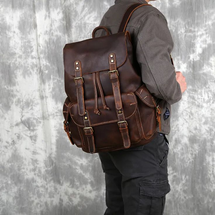 This Crazy Horse Leather Men's Backpack is made with top layer cowhide and genuine cow leather for durability and comfort. Its generous 20-35 litre capacity makes it a great option for school or travel, and its large soft handle offers extra convenience. Arcuate shoulder straps provide even weight distribution, making it ideal for carrying heavier loads. Your browser does not support our video. Product Information Main Material: Top layer cowhide Capacity: 20-35 Litre Handle/Strap Type: Soft Han