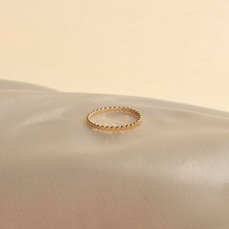 A dotted stacker ring to add to your ring party. Made with 14k gold filled that is safe in the shower and will never turn your finger green! Details 2mm band width. 100% 14k gold filled material (tarnish-free and sensitive skin-friendly yay!) Warranty We do understand that handmade jewelry can be delicate, that's why we are offering a 30-day warranty for your purchase. If your item has a manufacturing defect or broken during this time frame, please contact us and we will offer free repair for yo Ring Layering, Green Details, Stacker Rings, Freshwater Pearl Jewelry, Gold Rings Stackable, Chunky Earrings, Ringe Gold, Etsy Gold Ring, Party Rings