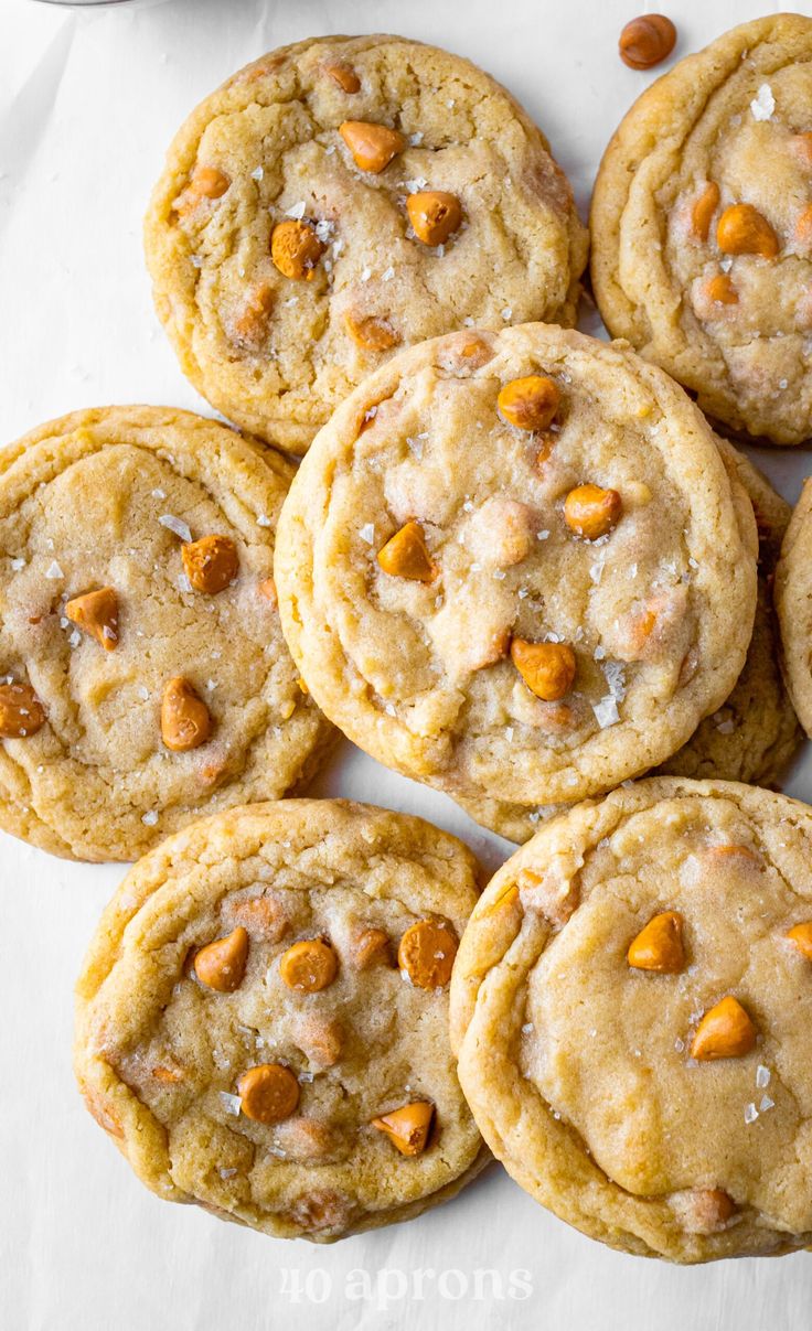 a pile of cookies sitting on top of a white table