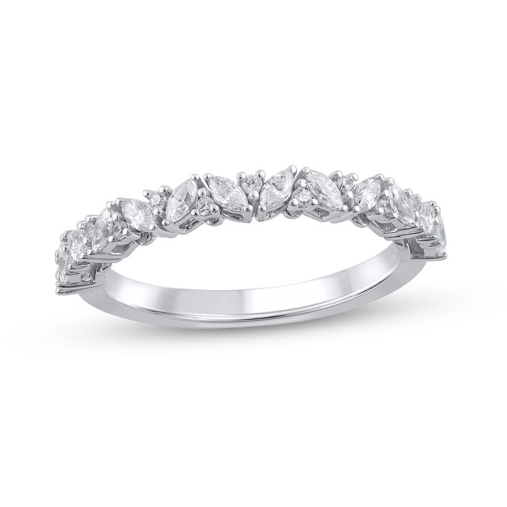 a white gold wedding ring with five pear shaped diamonds on the side and four rows of round