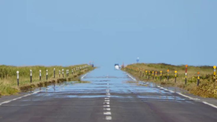 an empty road is shown in the middle of nowhere