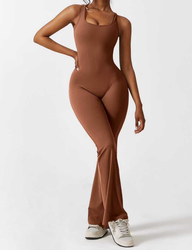 This jumpsuit is made of a durable and non-deforming fabric with a soft and moisture-wicking feel. It has a four-way stretch design that is comfortable and keeps you dry. The back has a stylish cutout that highlights the elegant butterfly bone structure. The deep V cut and scrunch at the hips enhance your silhouette. The flared shape elongates the legs and accentuates their curves. This jumpsuit is perfect for casual wear, sports, yoga, fitness, and various workouts.   Feature   Backless design Sleek Stretch Summer Jumpsuits And Rompers, Sleek Sleeveless High-stretch Jumpsuits And Rompers, Chic Fitted Flare Jumpsuits And Rompers, Sleek Stretch Jumpsuits And Rompers For Summer, Chic Stretch One-piece Jumpsuits And Rompers, Chic Full-length Stretch Bodysuit, Chic Full Length Stretch Bodysuit, Chic Stretch Jumpsuits And Rompers, Stretch Elastane Backless Jumpsuits And Rompers