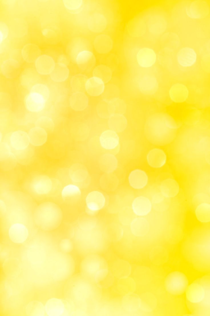 blurry image of green and yellow boket background with focus on the camera lens