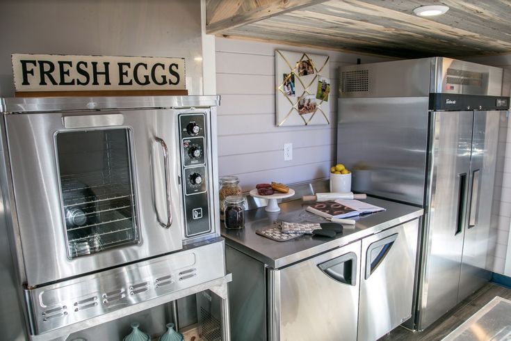 the kitchen has stainless steel appliances in it