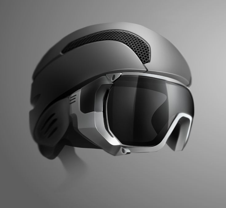 a helmet and goggles are hanging on the side of a gray wall with a grey background