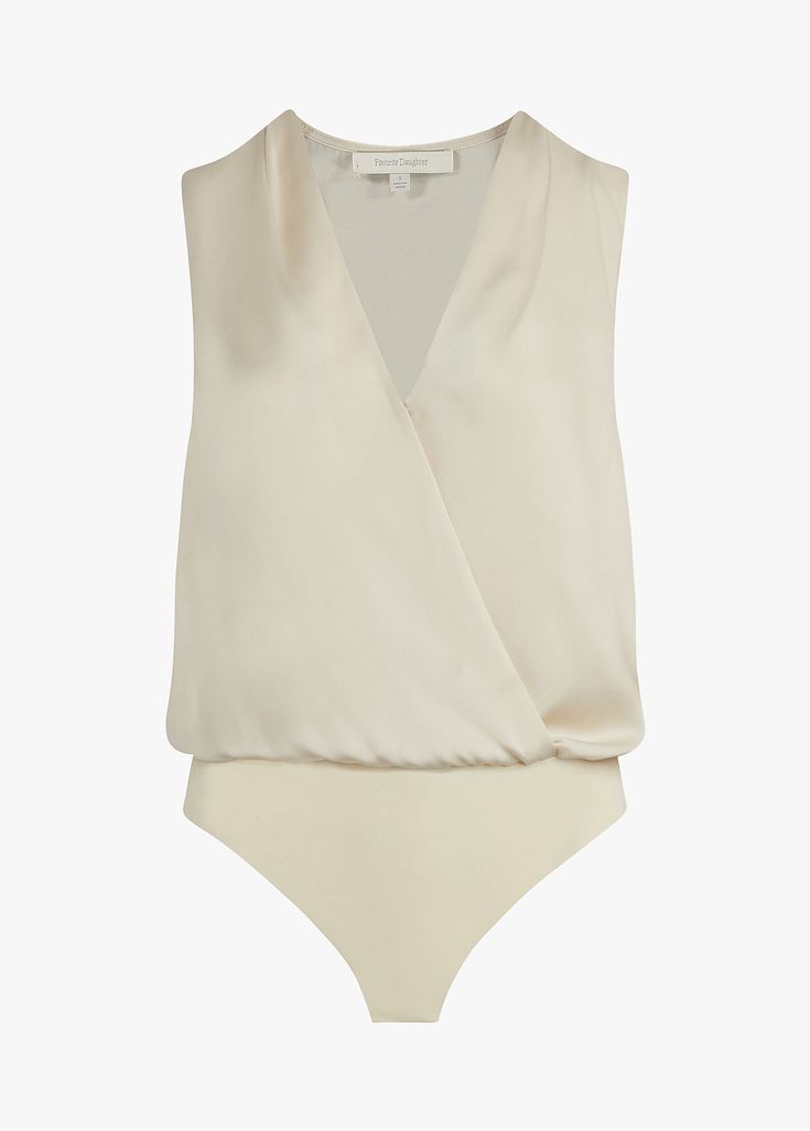 Text me when you get home. Our best-selling, satin bodysuit with a pleated neckline and button cuffs, now in a sleeveless version. The soft drape of the top is a no-fuss tuck thanks to the comfortable snap bodysuit so it's effortlessly easy to wear on its own and a favorite look when styled under a blazer.100% POLYESTERAdrianna is 5'9" wearing size Small Chic Sleeveless Top With Satin Finish, Sleek Summer Bodysuit For Workwear, Sleek Summer Workwear Bodysuit, Cream Satin Tops For Formal Occasions, Cream Satin Top For Formal Occasions, Formal Cream Satin Top, Chic Sleeveless Bodysuit For Date Night, Sleek Sleeveless Bodysuit For Workwear, Elegant Sleeveless Bodysuit For Evening