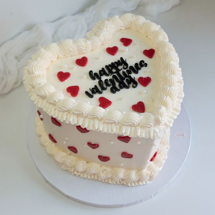 a heart shaped cake with the words happy valentine's day written on it