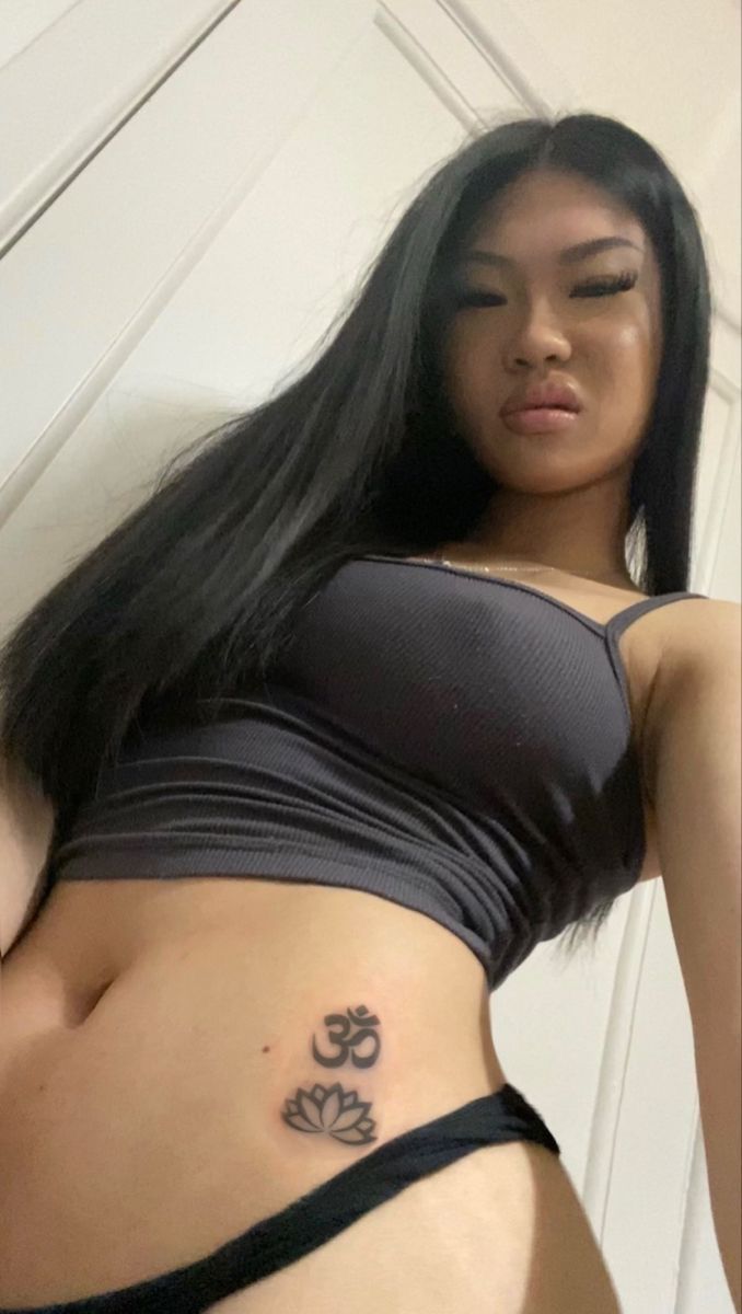 a woman with a tattoo on her stomach