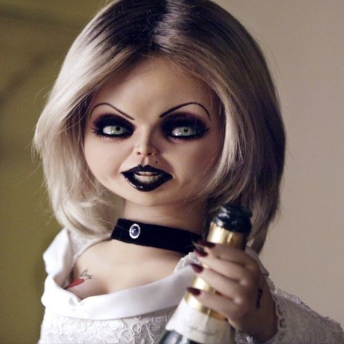 a woman with makeup holding a wine bottle