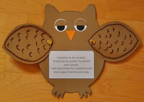 an owl cut out with a sign on it