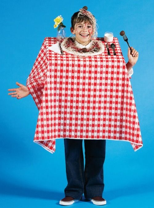 a woman dressed in a red and white checkered ponchy