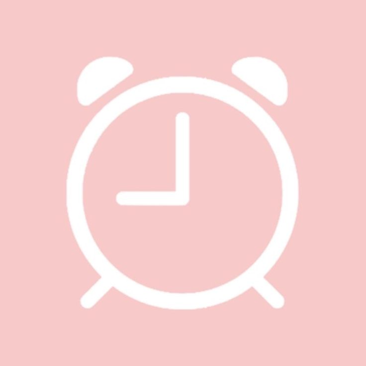 an alarm clock on a pink background