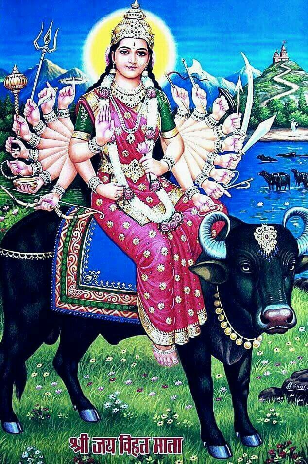 the goddess sitting on top of a cow