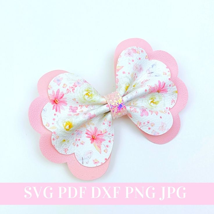 a pink and white flower shaped hair clip