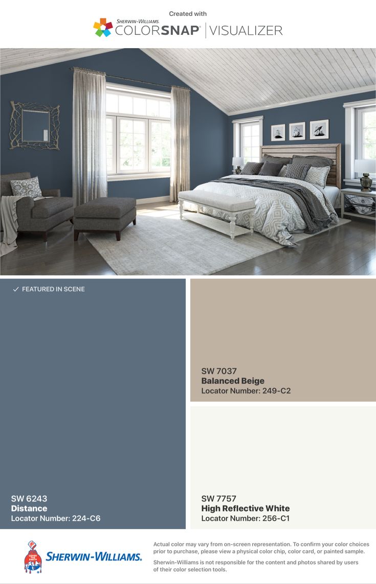 the color scheme for this bedroom is blue and gray, with white trim on the walls