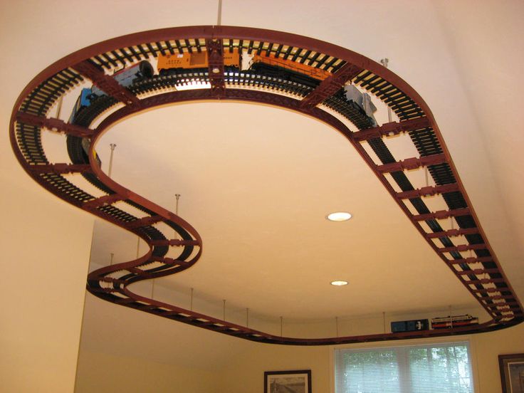 a model train track suspended from the ceiling