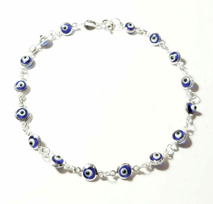 Evil eye bracelet 925 Sterling silver amulet Lampwork Blue glass eye beads Murano Greek mati Chain & link bracelet Silver Greek jewelry Good luck jewelry Evil eye protection jewelry Baptism Baby Shower Jewelry Anniversary Gift Layering bracelet Dimensions: About 18 cm  or 7.09 inches long Evil eye diameter 0.5 cm Silver Evil Eye Bracelet Spiritual Style, Silver Evil Eye Chain Bracelet Gift, Silver Spiritual Bracelet With Evil Eye, Spiritual Silver Bracelet With Evil Eye, Handmade Blue Evil Eye Bracelet In Sterling Silver, Handmade Silver Evil Eye Bracelet, Adjustable Silver Chain Bracelet With Evil Eye, Handmade Sterling Silver Blue Evil Eye Bracelet, Silver Chain Bracelet With Evil Eye Detail