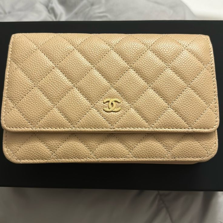 Brand New. Wallet On Chain. Beige Color. In Grained Calfskin And Gold Tone Metal, Beige. Still Under Warranty With Chanel. Size Base Length: 7.5 In Height: 5 In Width: 1.5 In Drop: 25 In Comes With Box And Dustbag. Classic Formal Caviar Leather Bag, Elegant Everyday Wallets With Gold-tone Logo Plaque, Classic Wallet On Chain With Gold-tone Logo Plaque, Luxury Gold Leather Wallet, Classic Formal Wallet With Chain Strap, Luxury Rectangular Wallet On Chain With Gold-tone Logo, Classic Leather Wallet With Chain Strap, Gold Leather Wallet On Chain With Logo Plaque, Gold Leather Wallet On Chain With Gold-tone Logo