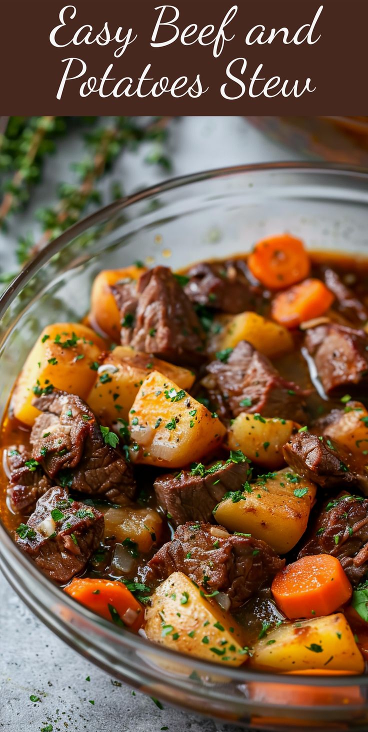 beef and potatoes stew in a glass bowl with parsley sprinkled on top