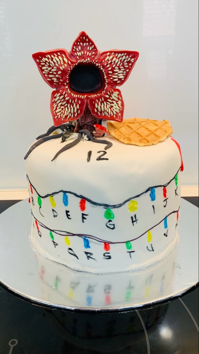 a decorated cake sitting on top of a table