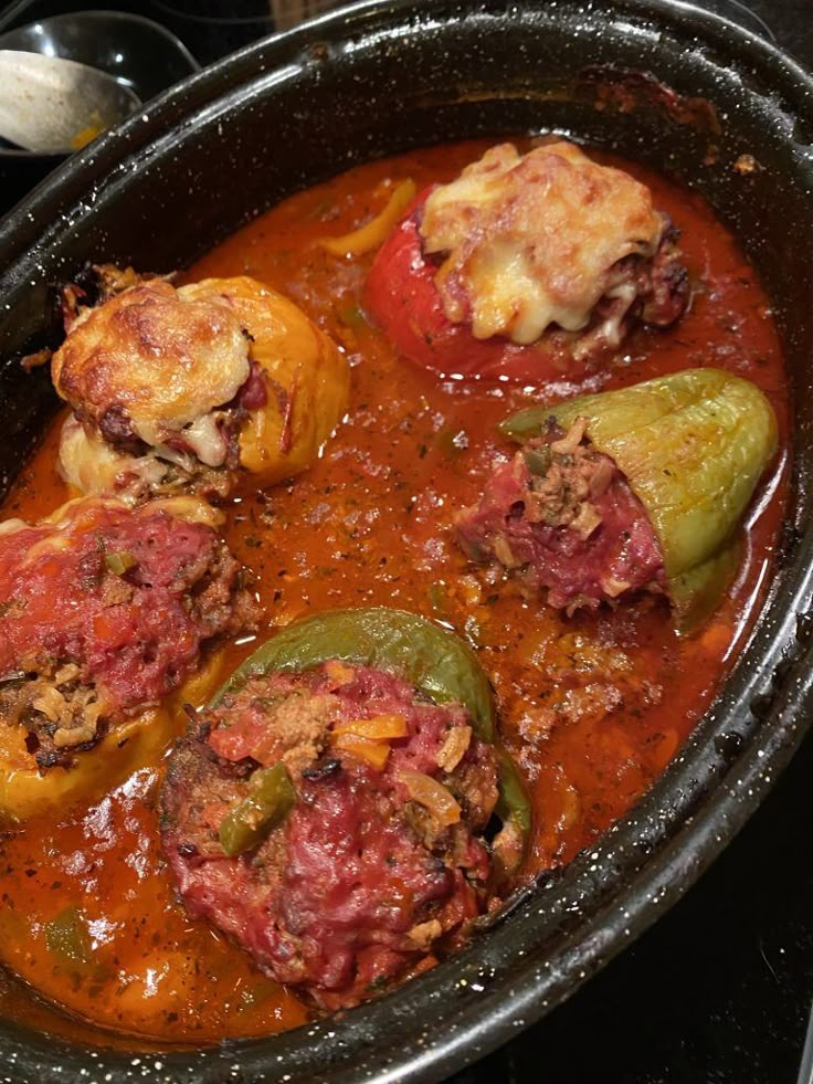 a pot filled with meat and vegetables covered in sauce