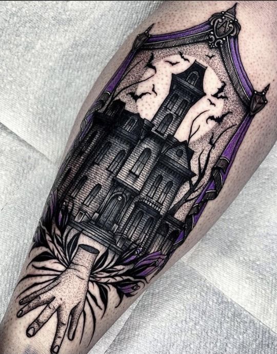 a black and grey tattoo with a clock on it's arm, in front of a white background