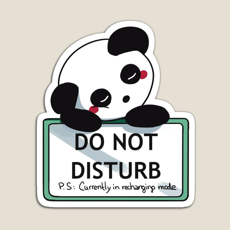 a panda bear sitting on top of a do not disturb sign