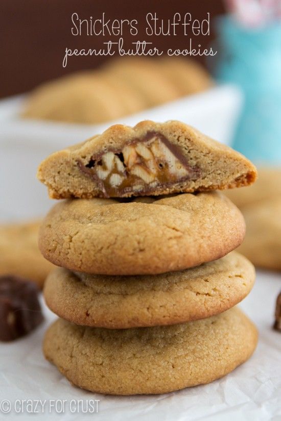 a stack of cookies sitting on top of each other with chocolate chips in the background