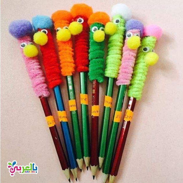 a group of colorful pencils with different colored animals on them sitting next to each other