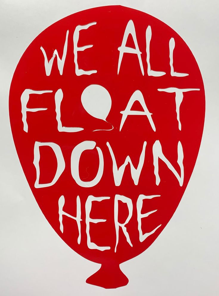 we all float down here sign on the side of a building