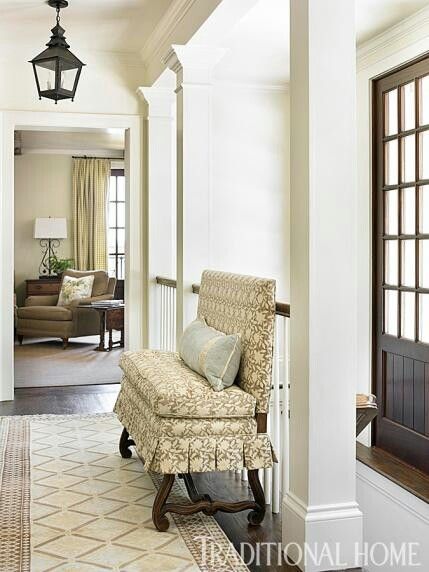 an image of a living room with furniture on the floor and in front of a door