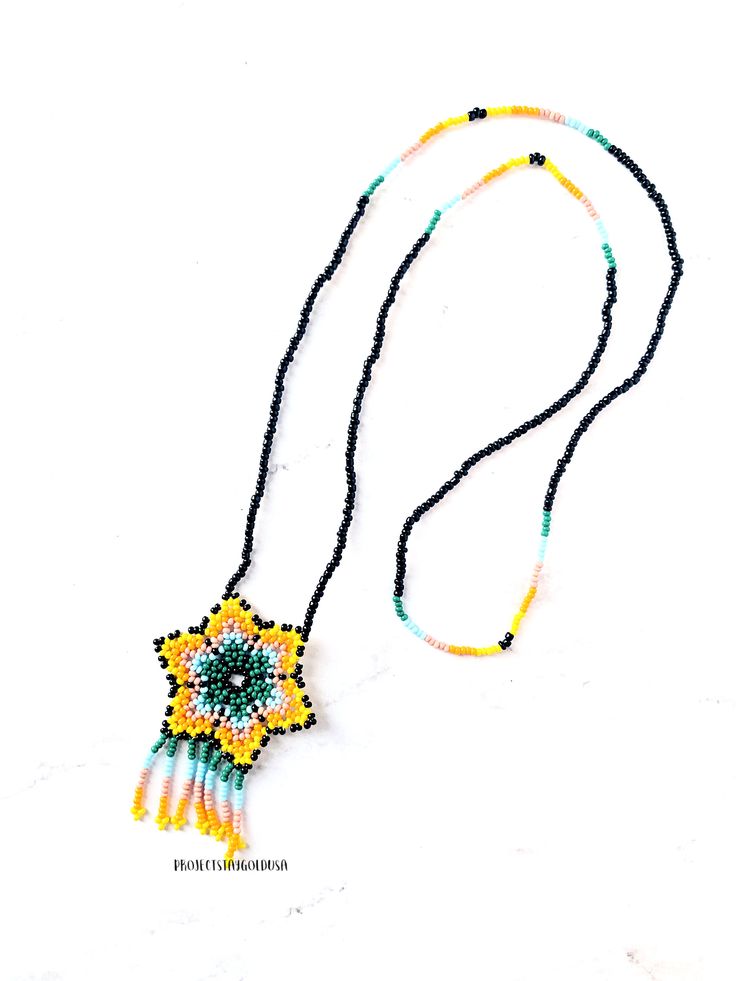 ♡Measurements: //approximate, all are handmade so may slightly vary Necklace length: 40 Centimeters; Pendant height: 7 Centimeters; Pendant width: 4 Centimeters These are representative of the Huichol. Like the Mixtec tribe, Huichol are one of the few indigenous tribes left in Mexico and they isolate themselves in the mountains in western central Mexico, specifically Sierra Madre Occidental. These beads and designs are sacred and symbolic in the Huichol culture. Add this one of a kind beautiful Hand-strung Bohemian Beaded Necklaces For Festivals, Bohemian Hand-strung Beaded Necklaces For Festivals, Handmade Southwestern Beaded Necklaces For Beach, Bohemian Beaded Chain For Crafting, Traditional Beaded Chain For Beach, Artisan Hand-strung Beaded Necklaces For Festivals, Bohemian Beaded Necklaces With Colorful Beads For Crafting, Artisan Hand-strung Beaded Necklace For Festival, Bohemian Adjustable Beaded Necklace With Black Beads