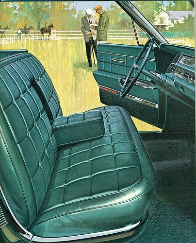 the interior of an old car with two men standing in front of it and horses