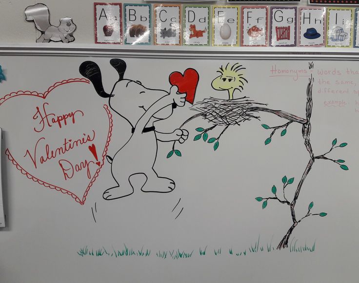 a white board with writing on it that says happy valentine's day and a drawing of a dog holding a heart