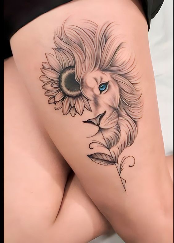 a woman's thigh with a tattoo of a lion and a sunflower on it