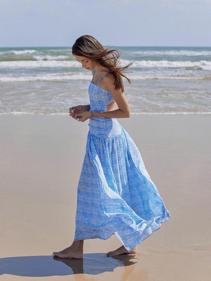 This product is a charming spaghetti strap dress that captures the casual essence of summer with its airy and free-flowing design. The bodice is neatly shirred, providing both texture and a snug fit, while the skirt flares out from a cinched waist into a relaxed, breezy silhouette. Crafted from a lightweight fabric, this dress is perfect for sun-soaked days and warm evening gatherings. - The dress features slender spaghetti straps ideal for staying cool on hot days.- Shirring on the bodice adds a decorative touch while ensuring a flexible fit.- Its A-line skirt drapes gracefully, offering comfort and ease of movement.- The light fabric of the dress promises breathability and a soft feel against the skin. Airy Midi Dress For Beach And Summer, Flowy Ruched Maxi Dress For Vacation, Flowy Summer Sundress Midi Dress, Summer Flowy Midi Sundress, Flowy Spaghetti Strap Dress For Summer Outings, Vacation Ruched Maxi Dress With Flowy Skirt, Vacation Maxi Dress With Ruched Flowy Skirt, Casual Maxi Dress With Ruched Bodice And Spaghetti Straps, Breezy Sundress With Adjustable Straps