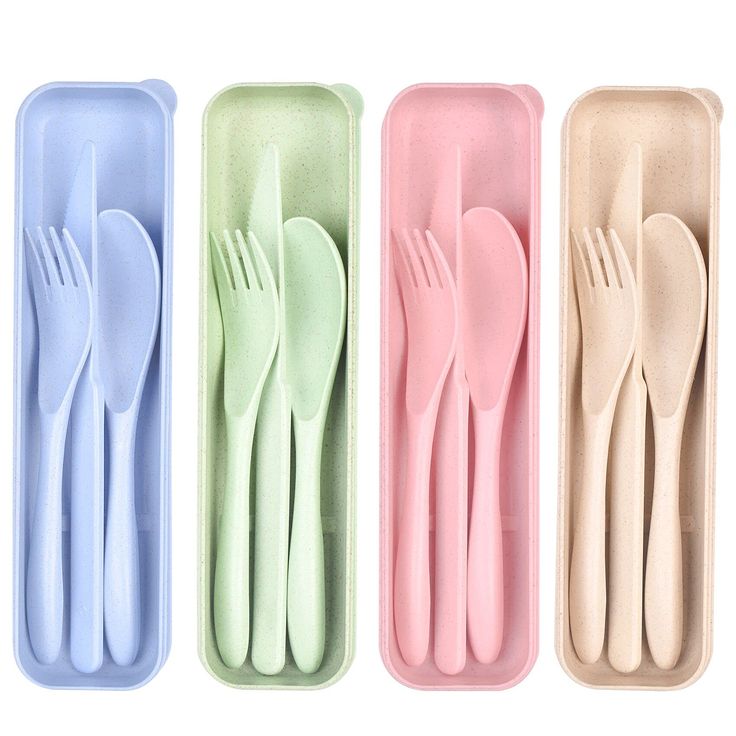 four different colored plastic utensils and spoons in an empty container on a white background