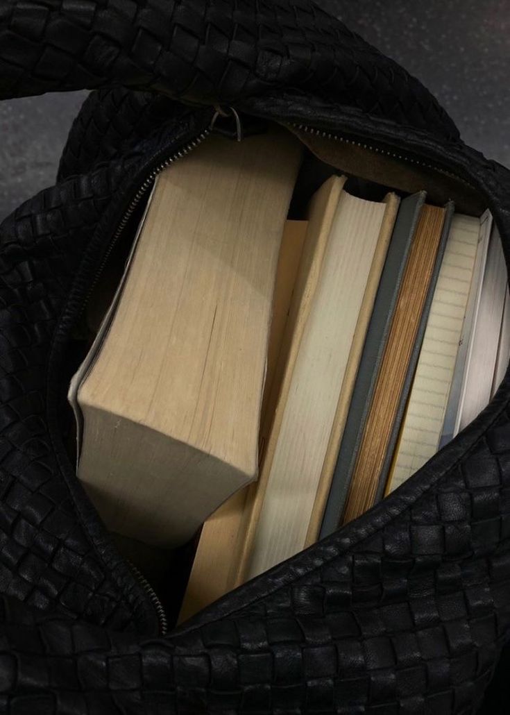 a black bag filled with lots of books